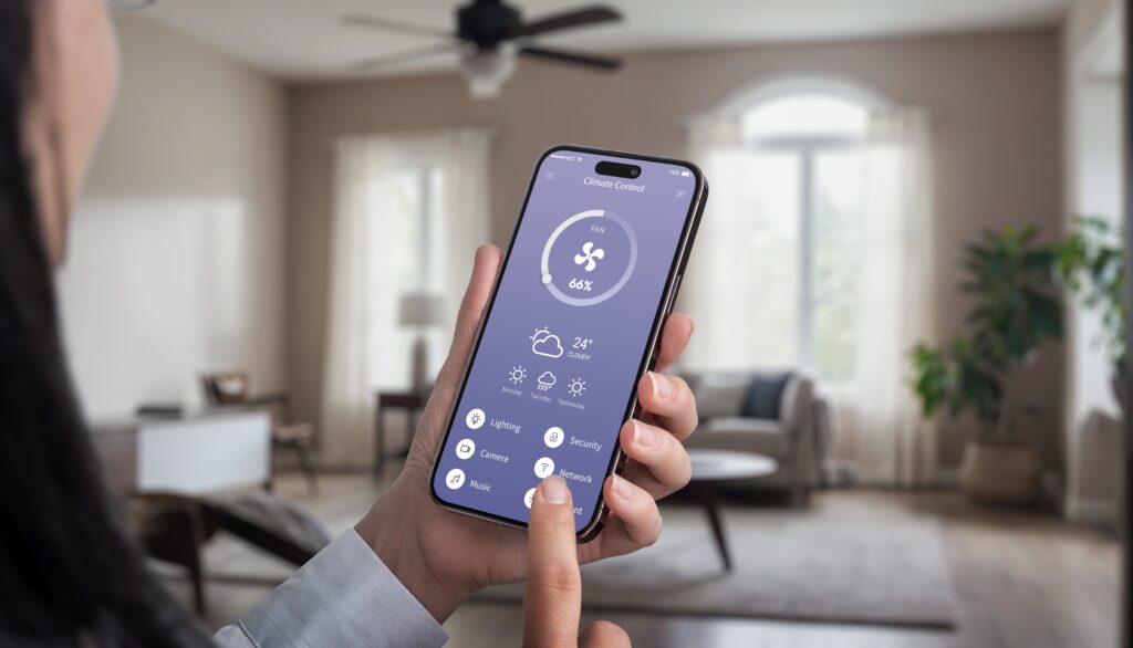 Woman using smartphone to control smart ceiling fan.